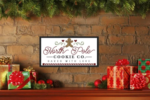 North Pole Cookie Company Gingerbread 11.5" x 21.5" Framed Christmas Wall Decor Sign Poster in a Black Wooden Frame with UV Acrylic and Hangers