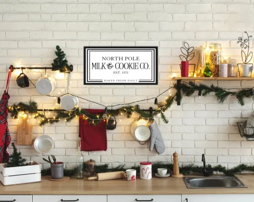 North Pole Milk and Cookie Company 11.5" x 21.5" Framed Christmas Wall Decor Sign Poster in a Black Wooden Frame with UV Acrylic and Hangers