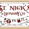 St Nick's Laundry Company Laundry Room 14.5" x 20.5" Framed Christmas Wall Decor Sign Poster in a Natural Wooden Frame with UV Acrylic and Hangers
